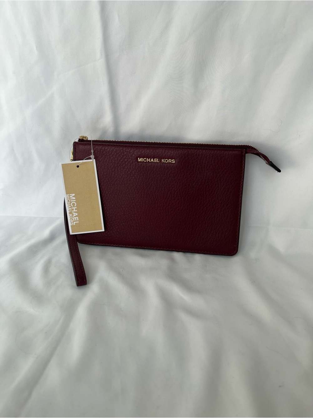 Michael Kors Merlot Pebbled Leather Wristlet with Gold Logo